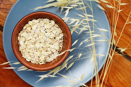 Oats cereal, cereals, rustic, wooden, background, diet breakfast, healthy lifestyleの写真素材
