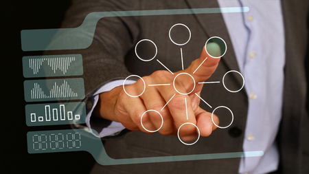 male businessman touch with the finger button on glass monitor, touch screen. Internet, technology, web business concept.の写真素材