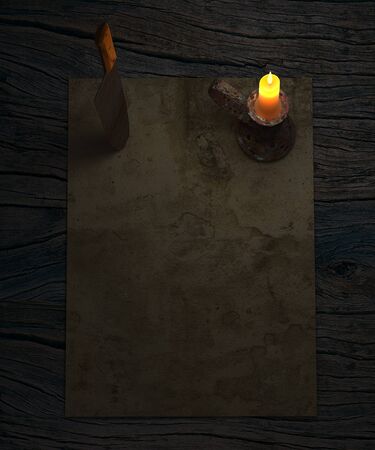 Scary , horror background with old paper, rusty butcher knife and candle on rustic wooden table.の写真素材