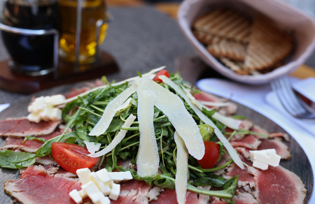 Carpaccio , beef steak salad. Summer launch, healthy eating conceptの写真素材