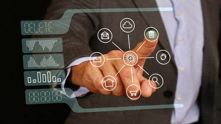 male businessman touch with the finger delete button on glass monitor, touch screen. Internet, technology, web business concept.の写真素材