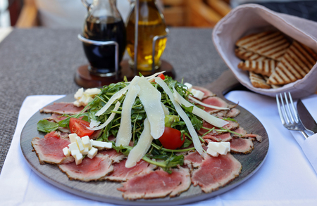 Carpaccio , beef steak salad. Summer launch, healthy eating conceptの写真素材