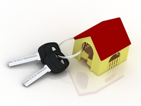 House key with shaped key-chain isolated on white background. Concept for owning, rental or buying a house, flat or apartment.の写真素材