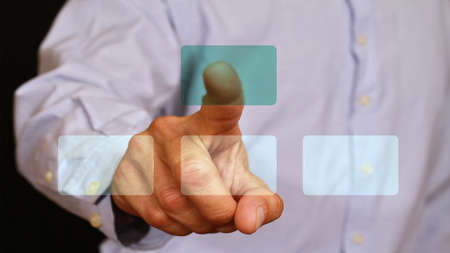 male businessman touch with the finger button on glass monitor, touch screen. Internet, technology,...