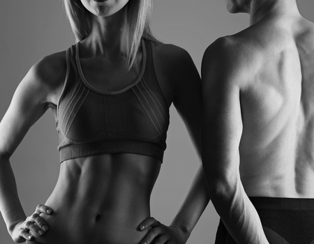 Fit couple, strong muscular man and slim woman . Sport, fitness ,workout concept.の写真素材