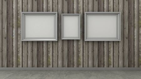 Empty picture frames in interior background on the rustic wooden wall with concrete floor. Copy space image.の写真素材