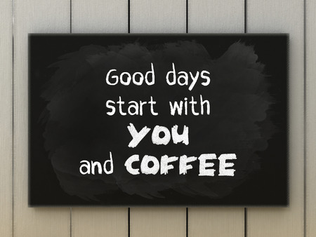 Coffee quote on blackboard written with chalk.の写真素材