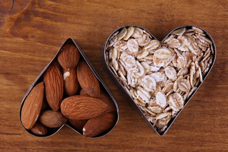 Raw almond and whole grain cereals , Healthy breakfast. High dietary fiber foodsの写真素材