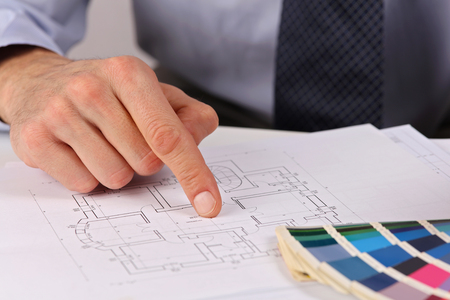 Architect pointing on project drawing, Project Manager showing house plans.の写真素材