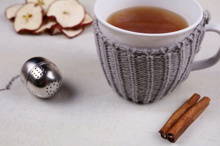 Apple cinnamon tea. Hot drink for cold winter and fly, warmth concept, cozy mugの写真素材