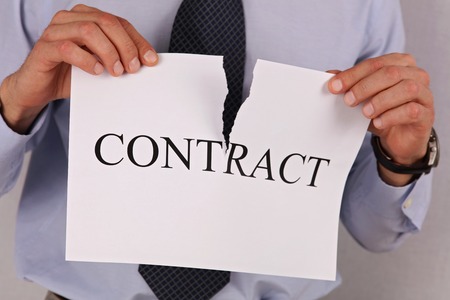 Businessman breaking contract close up. Termination of Contractの写真素材