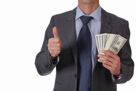 Business Man showing money with thumb up isolated on white background. Success, investment, financial growth, profit, dividends conceptの写真素材