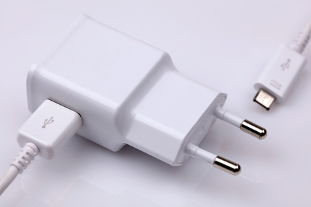 Cell, smart phone, mobile power charger on white background.