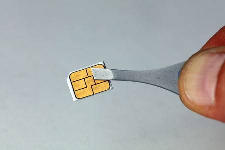 Close up on nano sim card. Cellular and mobile technologiesの写真素材