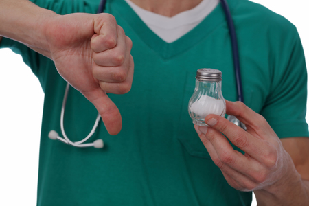 Doctor warning about salt. Health care concept, hypertension prevention. Isolated on whiteの写真素材