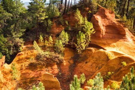 Ochre Trail in Roussillon, Sentier des Ocres, hiking path in natural colorful area of red and yellow...