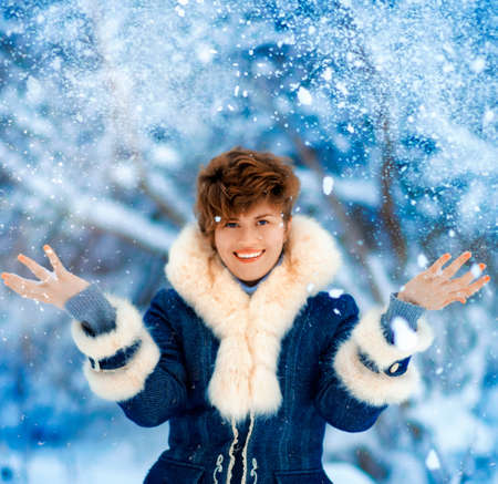 Portrait of joyful Winter Woman with short haircut in Luxury Fur Coat. Beauty Fashion Model Girl in...