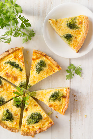 Broccoli pie on wooden tableの写真素材