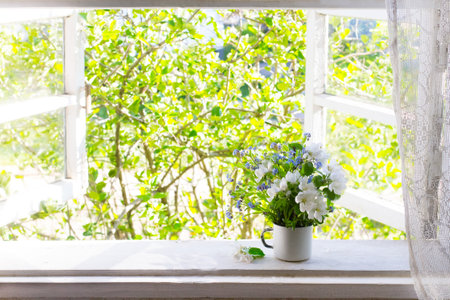 Bouquet of flowers on the windowsillの写真素材