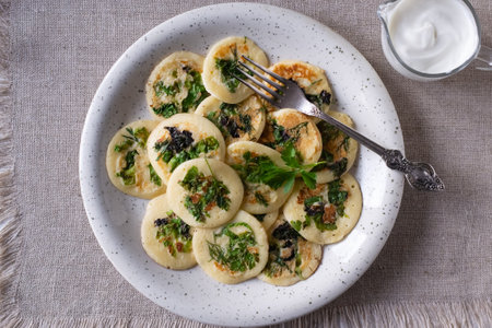 Fried dumplings with parsley on a plate