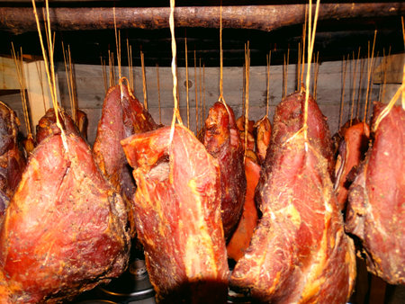 smoked meat in a traditional way, close-up of meat, sausages, smoke house, meat products, sausage, ham, bacon, food, meat, pantry,の写真素材
