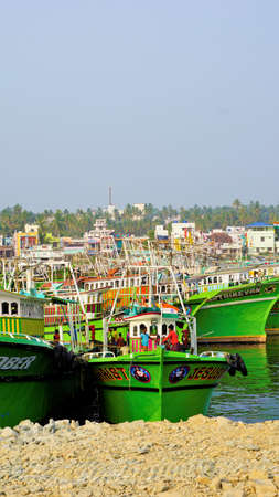 Colachel,Tamilnadu,India-December 23 2021: Boats and ships docked in Colachel Fishing harbor. Amazing view of silent harbour on christmas eveのeditorial素材