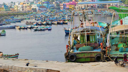 Colachel,Tamilnadu,India-December 23 2021: Boats and ships docked in Colachel Fishing harbor. Amazing view of silent harbour on christmas eveのeditorial素材