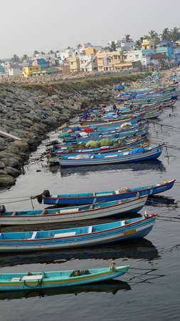 Colachel,Tamilnadu,India-December 23 2021: Boats and ships docked in Colachel Fishing harbor. Amazing view of silent harbour on christmas eveのeditorial素材