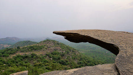 Hanging Rock of Avalabetta peak located in Chikaballapur, Karnataka. Picturesque Place to Trek in Serenity.の写真素材