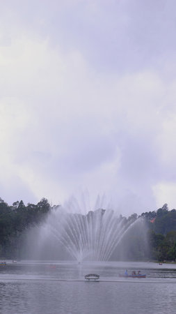 Amazing view of ooty lake with boats and fountain. Beautiful destination for couples, friends and families.の写真素材