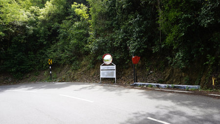 Outdoor traffic convex mirror in the hairpin bends and uphill road enroute to kodaikanal hilltop. Installed for improving safety.の写真素材