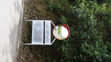 Outdoor traffic convex mirror in the hairpin bends and uphill road enroute to kodaikanal hilltop. Installed for improving safety.の写真素材
