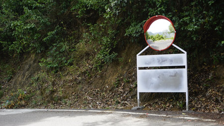Outdoor traffic convex mirror in the hairpin bends and uphill road enroute to kodaikanal hilltop....