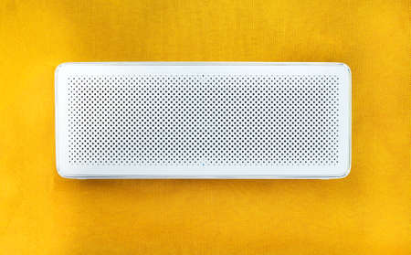 speaker on yellow background close up view.