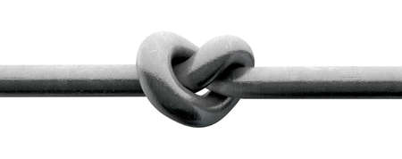 A metal pole twisted into a knotted shape that resembles a heart on an isolated backgroundの写真素材