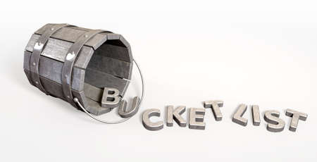 A toppled over metal vintage bucket charm with letter trinkets spilling out spelling the word bucket list on an isolated backgroundの写真素材