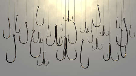 An array of fishing hooks in various sizes and shapes dangling on fishing line on an isolated backgroundの写真素材