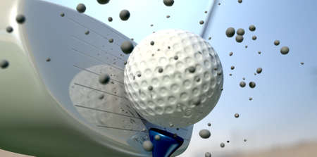 An extreme close up of a golf ball being hit off its tee with a club on a blue sky backgroundの写真素材
