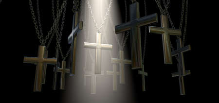 A group of metal crucifixes hanging from chains and a spiritual spotlight highlighting one in...