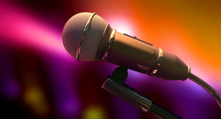 A black plastic and foam microphone on a blurry purple, orange and pink background, の写真素材