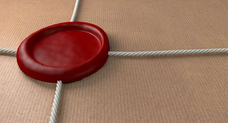 A closeup of a parcel wrapped in brown paper bound by a thin string and sealed by a blank red wax sealの写真素材