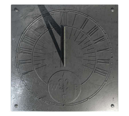 An old vintage sundial clock made of scratched metal with roman numerals on an isolated white studio...