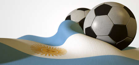 A regular stitched panel soccer ball resting on a draped argentina flag on an isolated white studio backgroundの写真素材