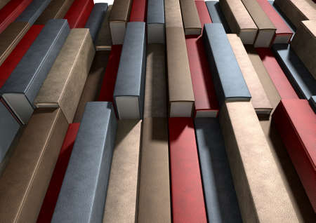 A pile of generic unbranded leather bound books on an isolated studio backgroundの写真素材