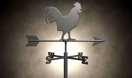 A regular metal weathervane with a cockeral motif facing north east with other directions depicted on an isolated backgroundの写真素材