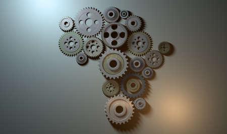 A concept showing an array of metal and steel cogwheels assemed into the shape of the african...