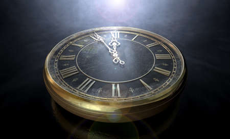 An extreme closeup of a section of a round antique watch with roman numerals and ornate metal hands approaching midnight on an isolated dark backgroundの写真素材