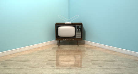 An old vintage television set in the corner of an empty room with light blue wall and a reflective wooden floorの写真素材