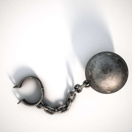 A vintage ball and chain with an open shackle on an isolated white studio background