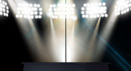An isolated stripper pole on a stage lit by an array of spotlights on a dark の写真素材